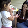 Arelis Rivera Negrón > Blowing bubbles w/Tití Madia.